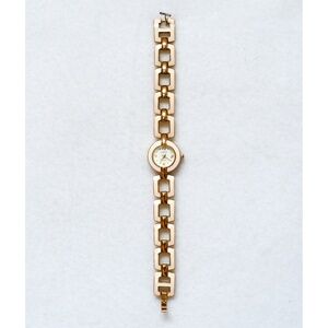 Studio gold and ivory colored enamel watch